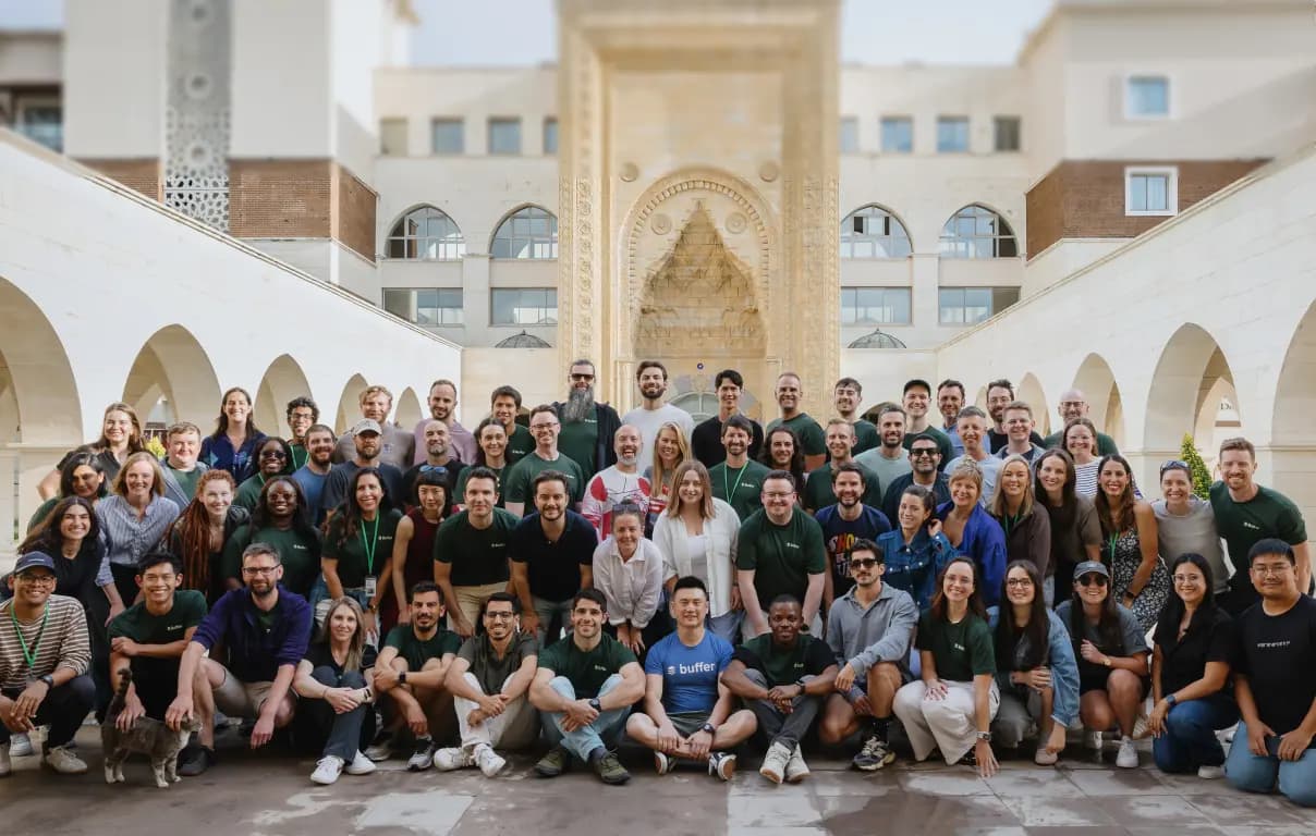 The Buffer team gathered during the 2025 Turkey retreat in front of a hotel with traditional relief carved decoration.